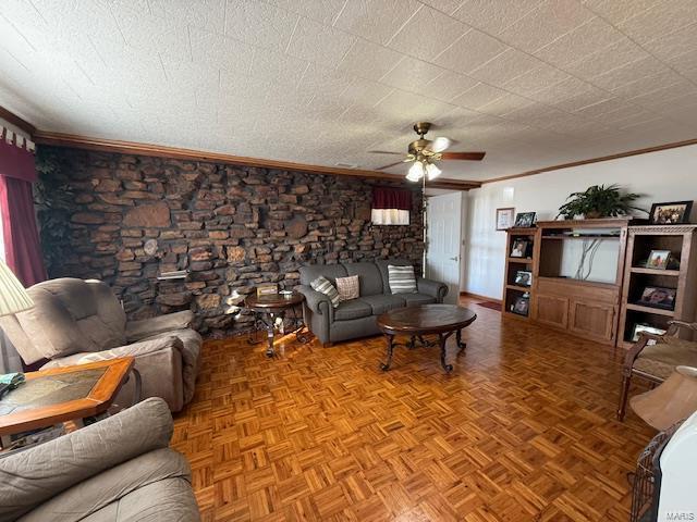 living room featuring ceiling fan, light parquet floors, and crown molding