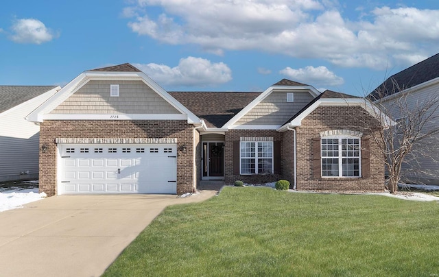 view of front of home with a garage and a front yard