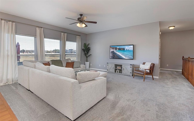 living room with ceiling fan and hardwood / wood-style floors