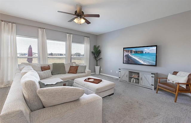 living room featuring ceiling fan and carpet floors