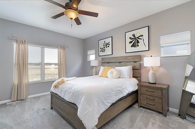 bedroom featuring ceiling fan and light carpet