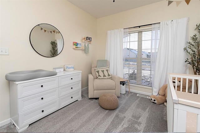 bedroom with light carpet and a crib