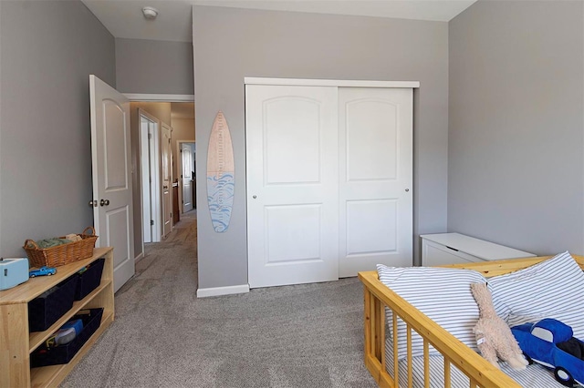 carpeted bedroom with a closet