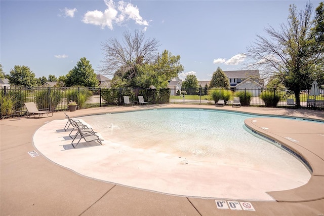 view of swimming pool featuring a patio area