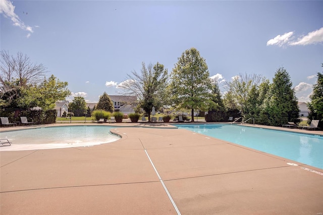 view of swimming pool with a patio area