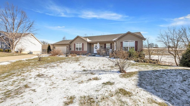 single story home featuring a garage