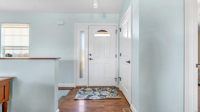 entrance foyer with dark hardwood / wood-style floors