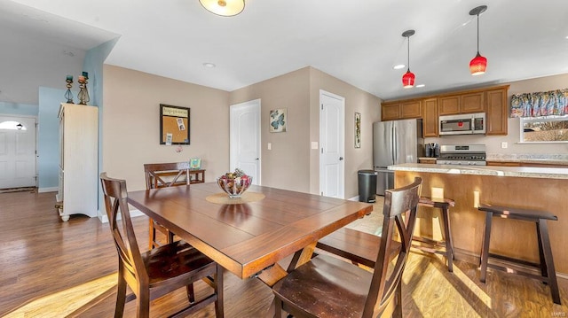 dining space featuring hardwood / wood-style flooring