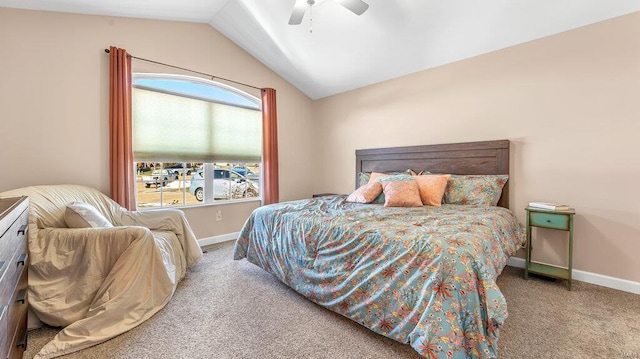 carpeted bedroom with ceiling fan and lofted ceiling