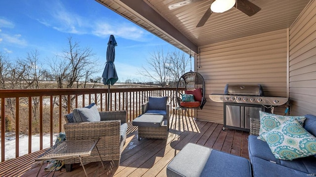 deck with ceiling fan, an outdoor living space, and area for grilling