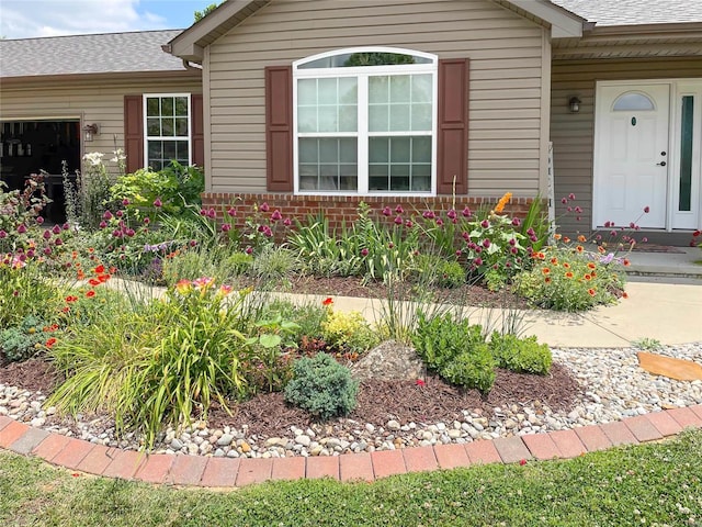 view of exterior entry featuring a garage