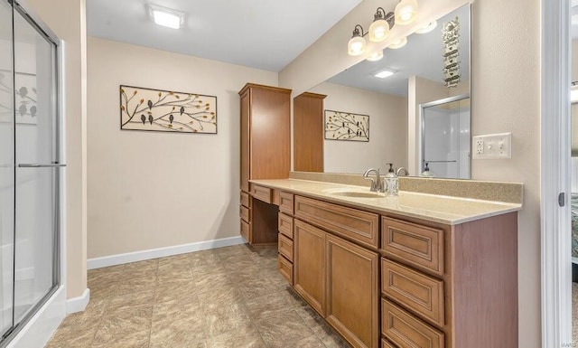 bathroom with an enclosed shower and vanity