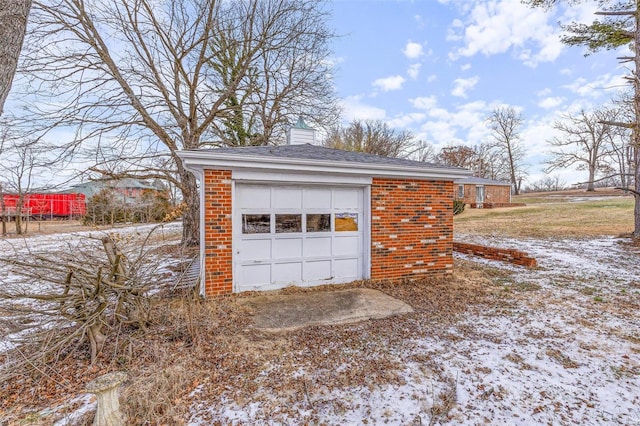 view of snow covered garage