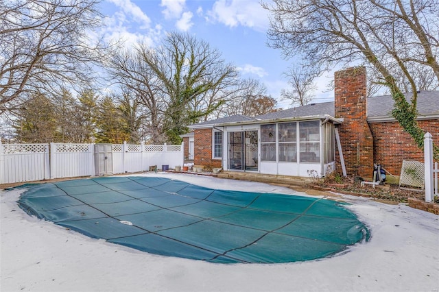 view of pool featuring a sunroom