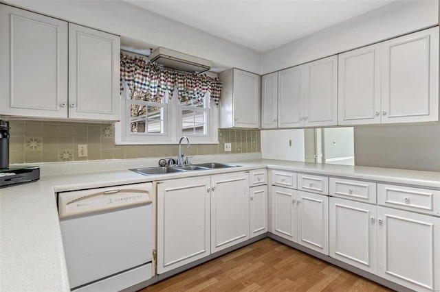 kitchen featuring white cabinetry, sink, and white dishwasher