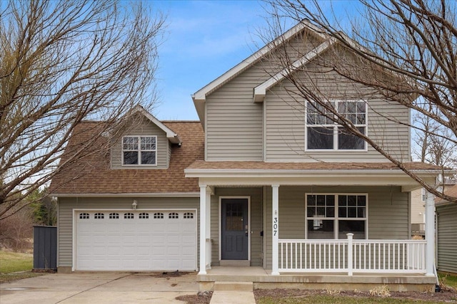 view of front of home with a garage, covered porch, driveway, and a shingled roof