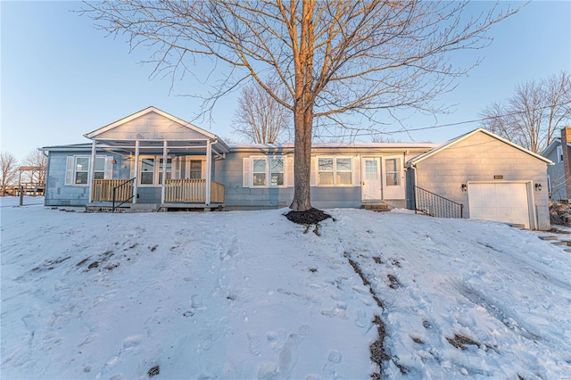 view of front of property featuring a porch and a garage