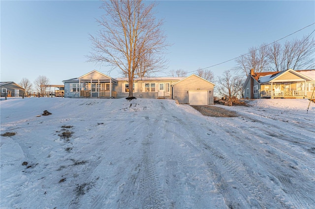 single story home with a garage and covered porch