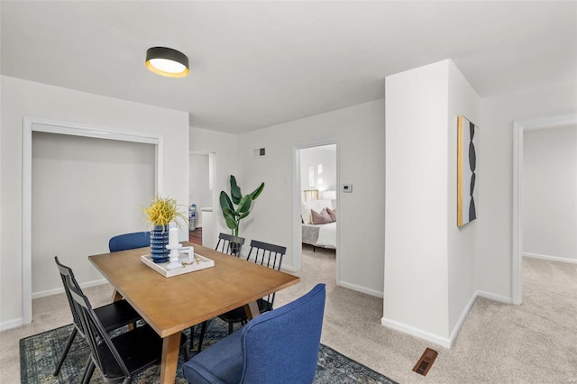 dining area featuring carpet floors