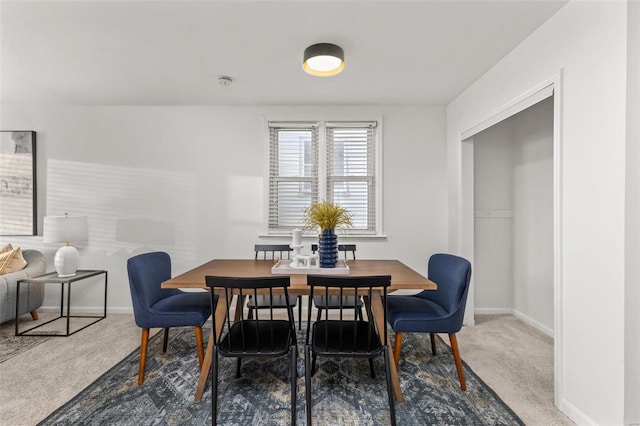 view of carpeted dining space