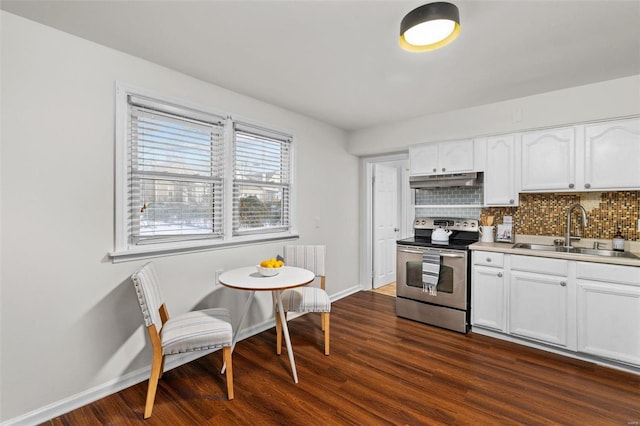 kitchen with white cabinetry, dark hardwood / wood-style flooring, sink, backsplash, and stainless steel range with electric stovetop