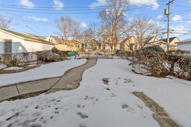 view of yard layered in snow