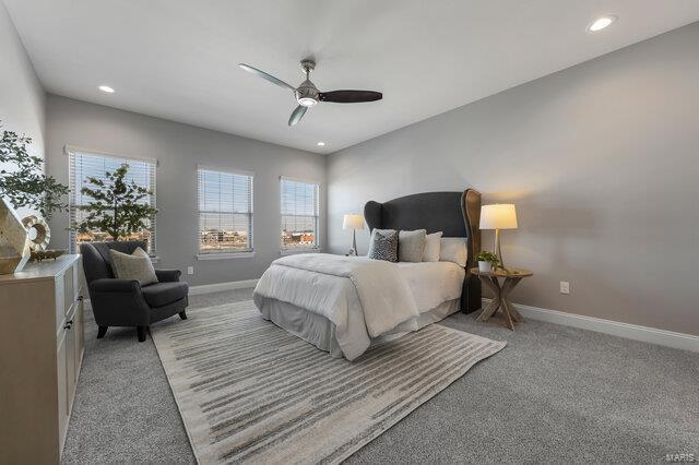 carpeted bedroom with ceiling fan