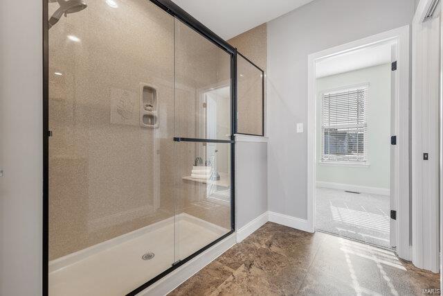 bathroom with an enclosed shower