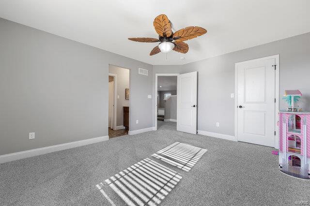 unfurnished bedroom featuring ceiling fan and carpet flooring