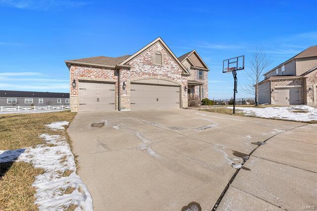 view of side of home featuring a garage