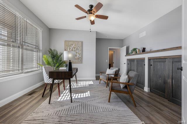 office area featuring dark wood-type flooring and ceiling fan