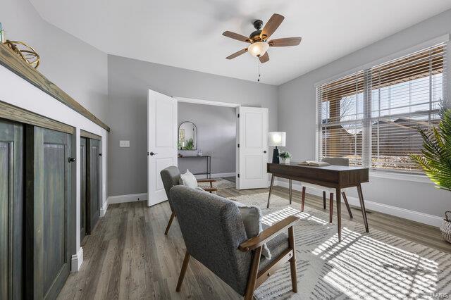 office space featuring hardwood / wood-style flooring and ceiling fan