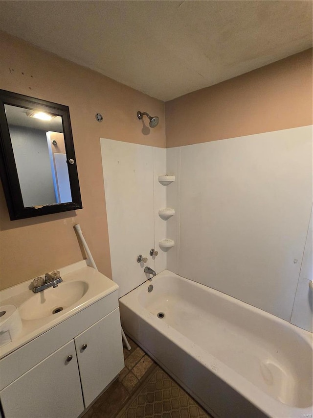 bathroom with tub / shower combination and vanity