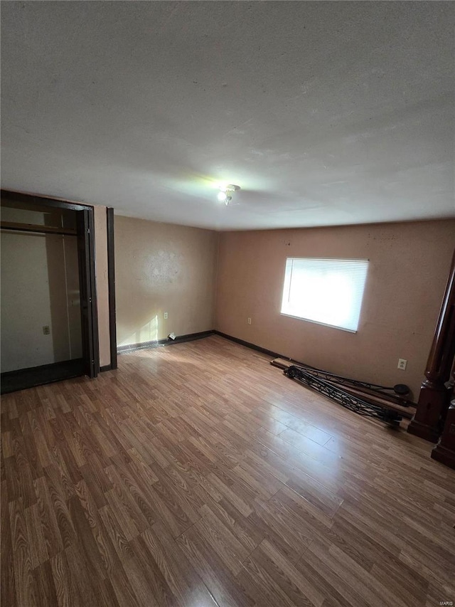 unfurnished bedroom featuring hardwood / wood-style floors