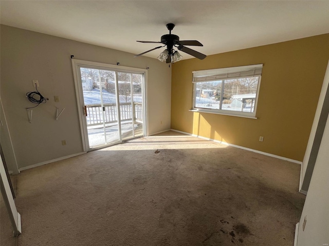 interior space featuring ceiling fan and baseboards