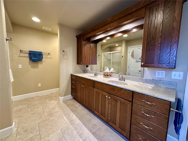 bathroom with vanity and walk in shower