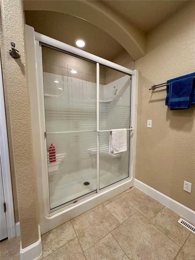 bathroom with an enclosed shower