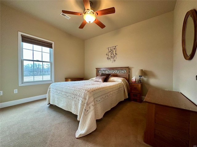 bedroom with dark carpet and ceiling fan