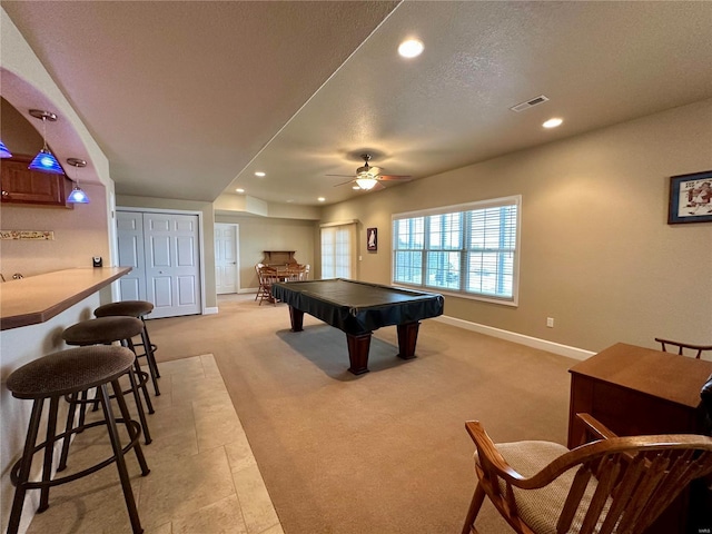 playroom featuring ceiling fan, pool table, light colored carpet, and a textured ceiling