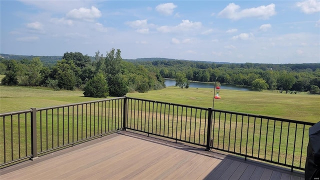 wooden terrace featuring a water view