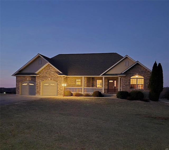 view of front of house with a garage and a porch