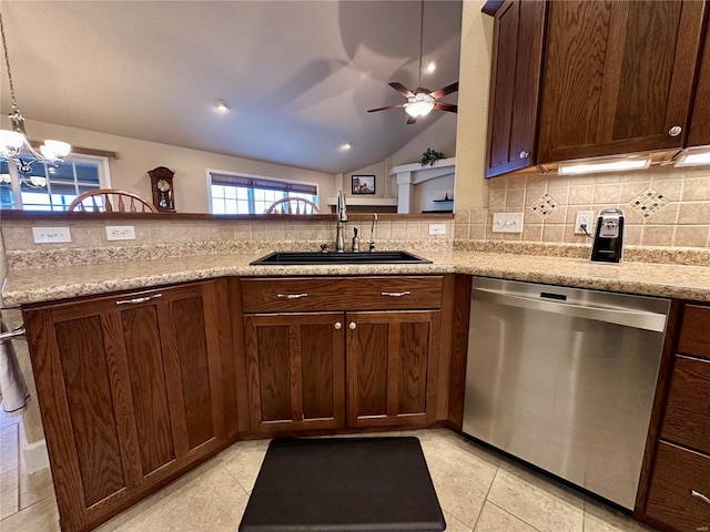 kitchen with lofted ceiling, sink, pendant lighting, dishwasher, and light stone countertops