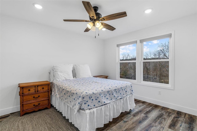 bedroom featuring dark wood-type flooring and ceiling fan