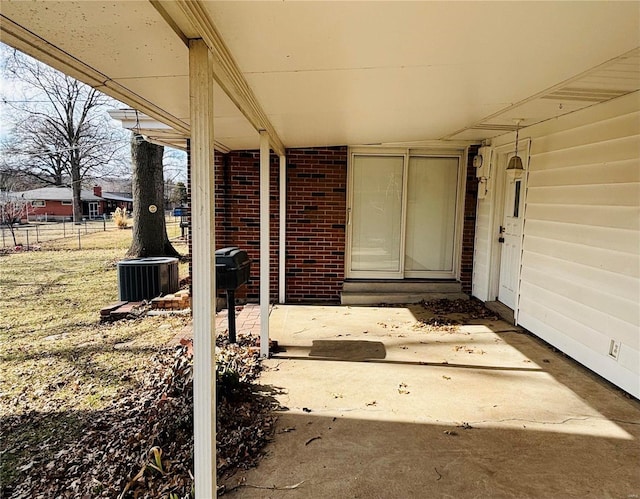 view of patio / terrace featuring central AC unit and fence