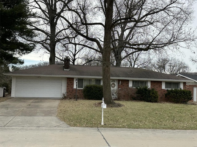 single story home with driveway, an attached garage, a front yard, and brick siding