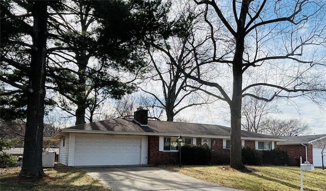 single story home with a garage, driveway, a chimney, a front lawn, and brick siding