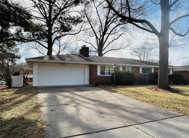 ranch-style house featuring a garage, concrete driveway, brick siding, and a chimney