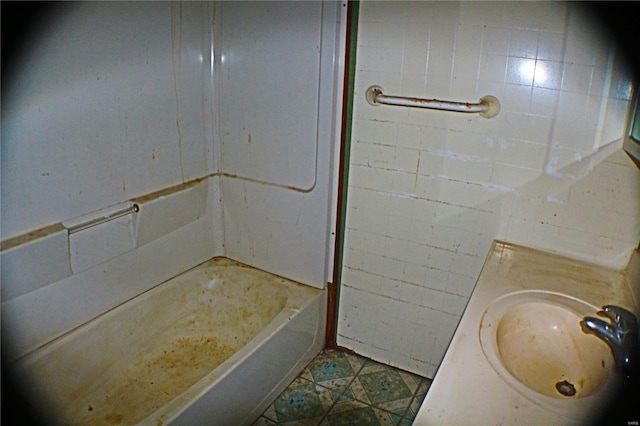 bathroom with sink and a bath