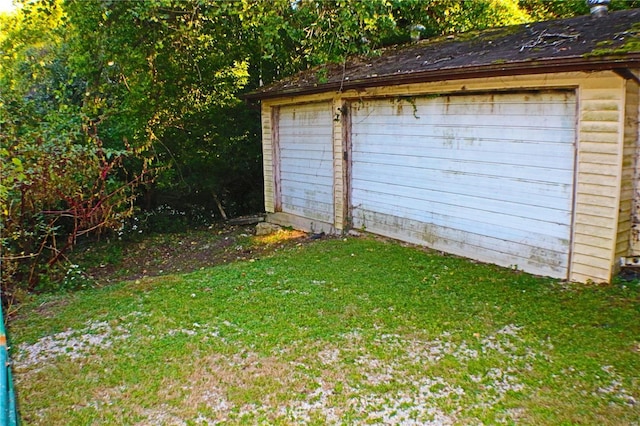 garage with a lawn