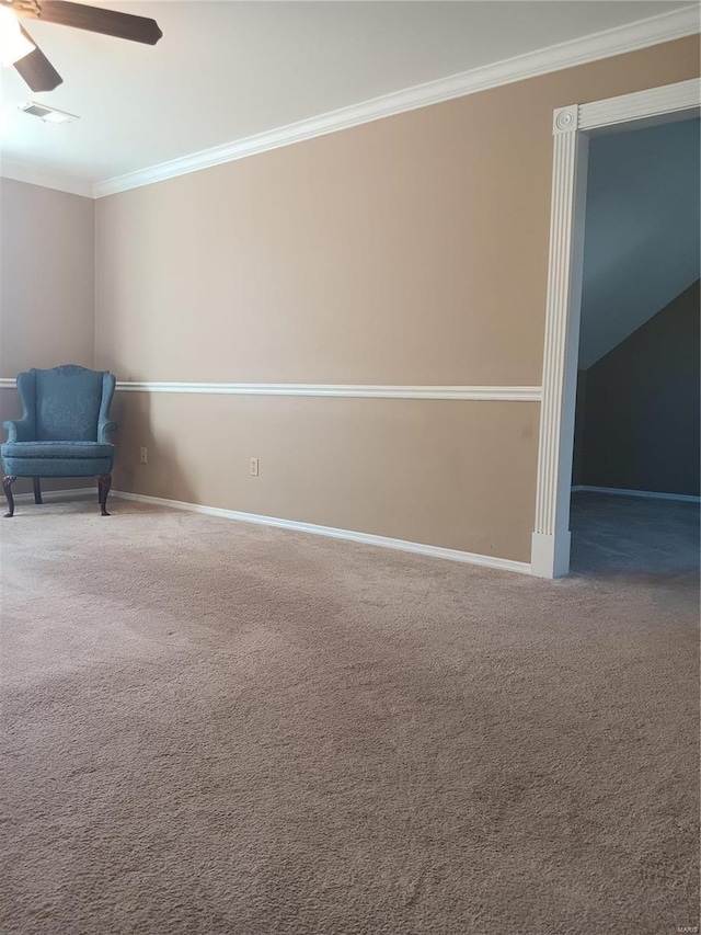 unfurnished room with ornamental molding, ceiling fan, and carpet